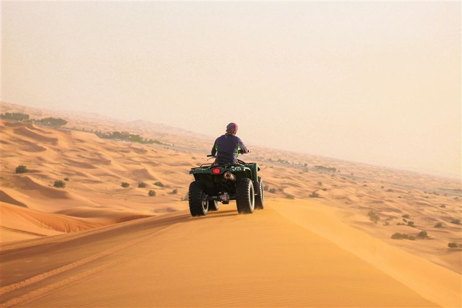 Quad bike riding across Dubai desert trails